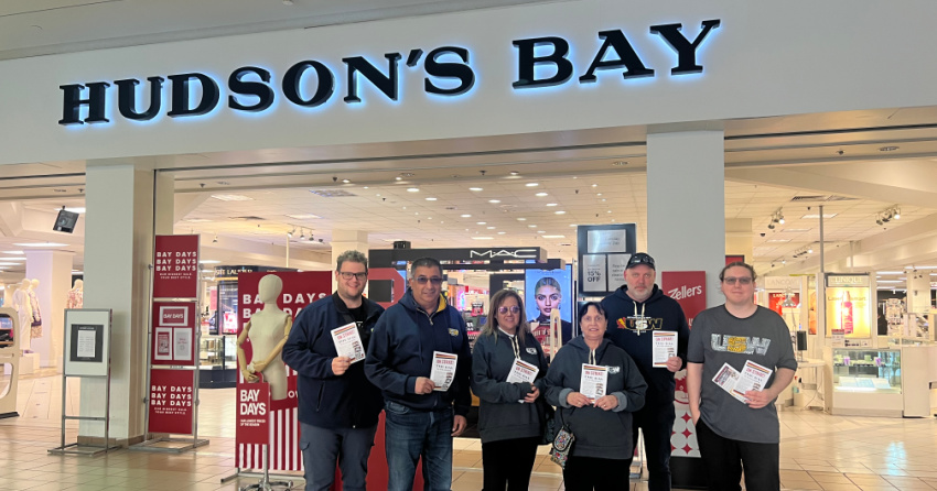 <who> Photo Credit: Contributed </who> Members of the USW outside the Metrotown Hudson's Bay.